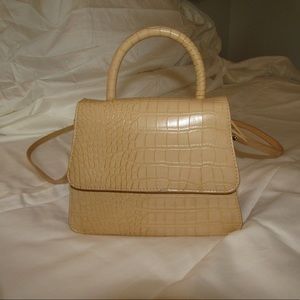 A. New day top handle crossbody bag. Yellow (color)